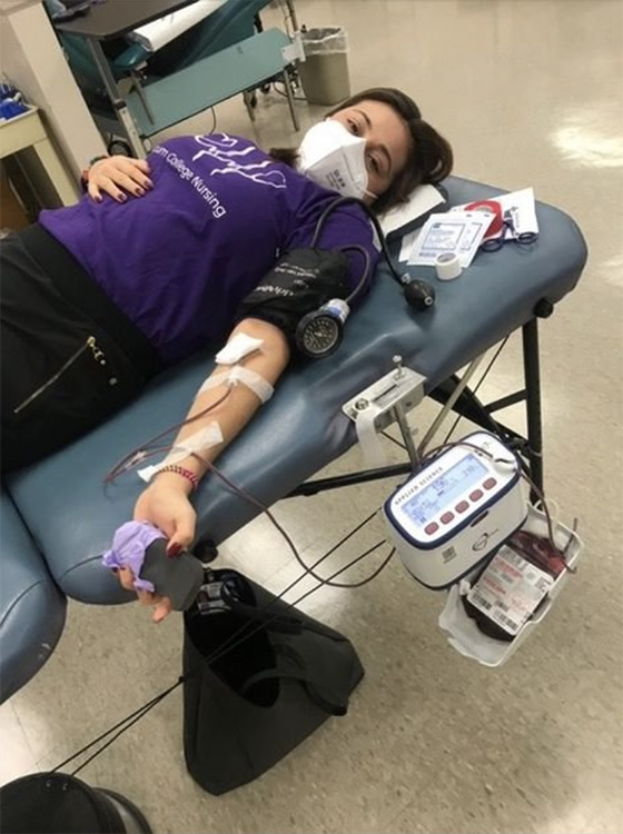 Cynthia Solis giving blood