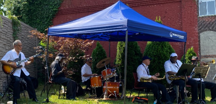 Band performing an outdoor concert