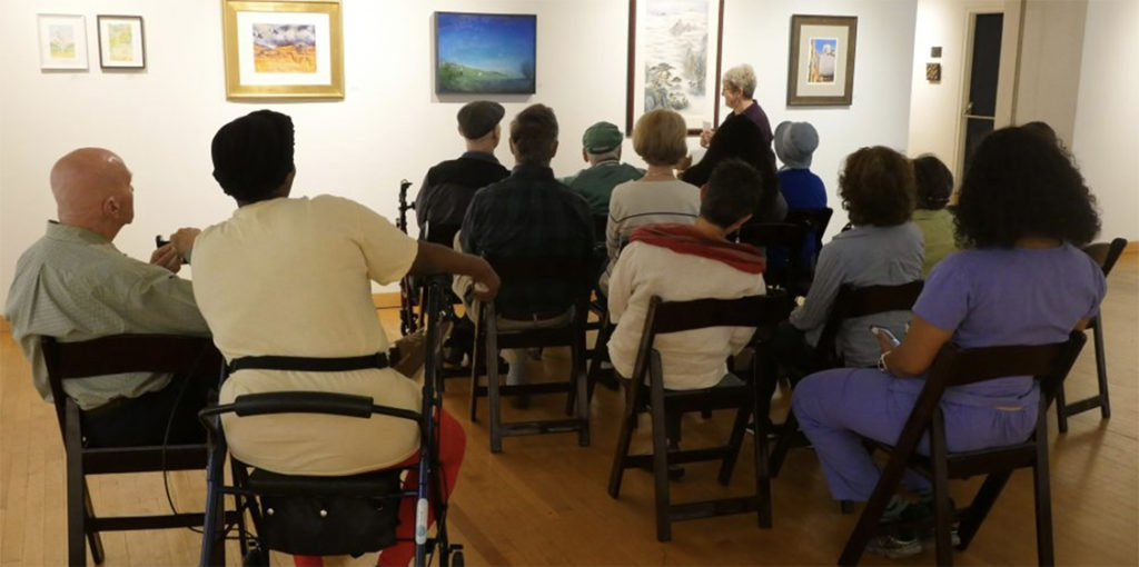 A group of ARTZ participants looking at art at Fleisher